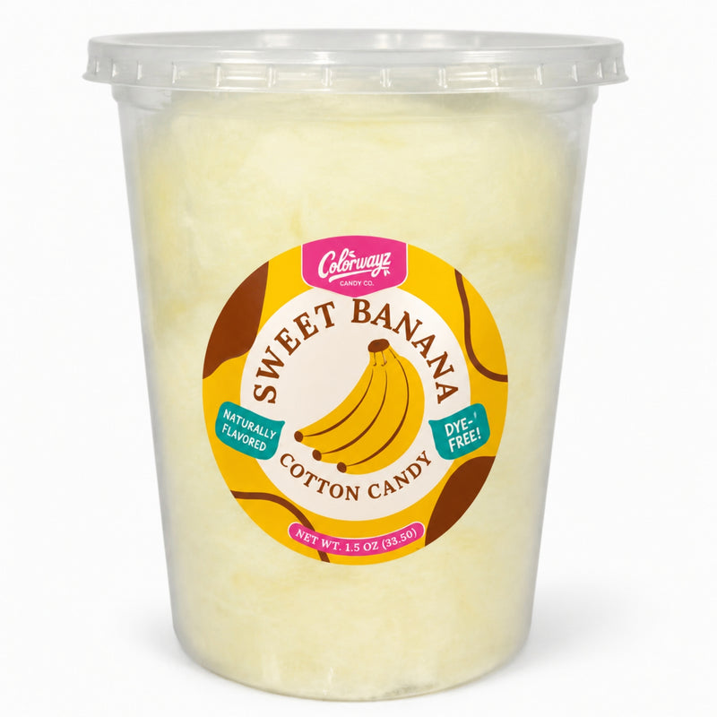 Colorwayz Sweet Banana dye-free cotton candy in a clear 32 oz deli tub with pale yellow cotton candy and a banana label.