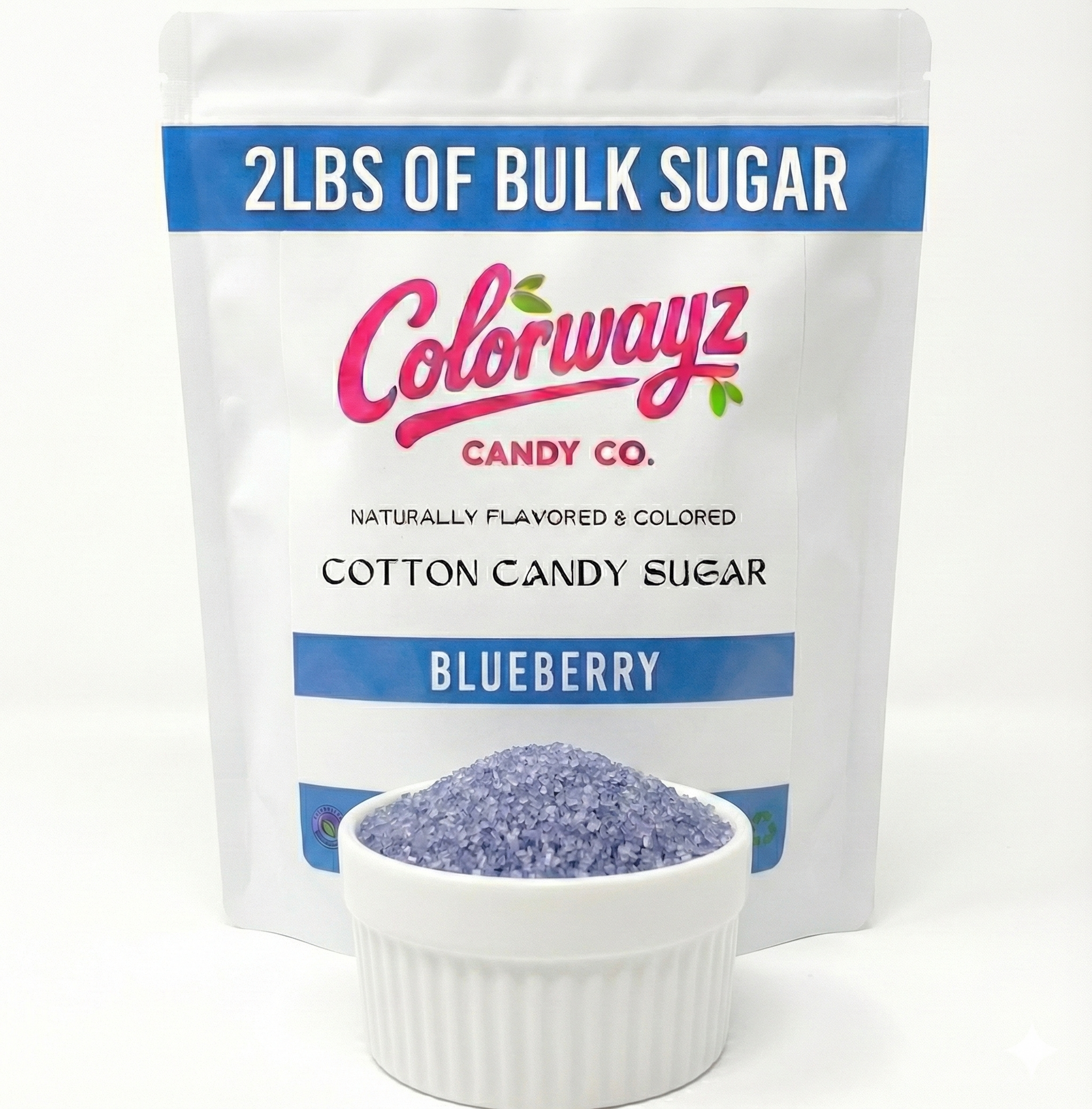 Blueberry cotton candy sugar crystals in bowl beside Colorwayz resealable pouch, naturally colored dye-free cotton candy sugar for home and commercial machines