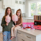 Children enjoying dye-free cotton candy made with Colorwayz cotton candy sugar using a home cotton candy machine