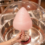 Strawberry cotton candy forming inside a cotton candy machine using Colorwayz sugar