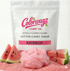 Watermelon cotton candy made from Colorwayz naturally flavored and colored cotton candy sugar, soft pink spun cotton candy beside resealable sugar pouch