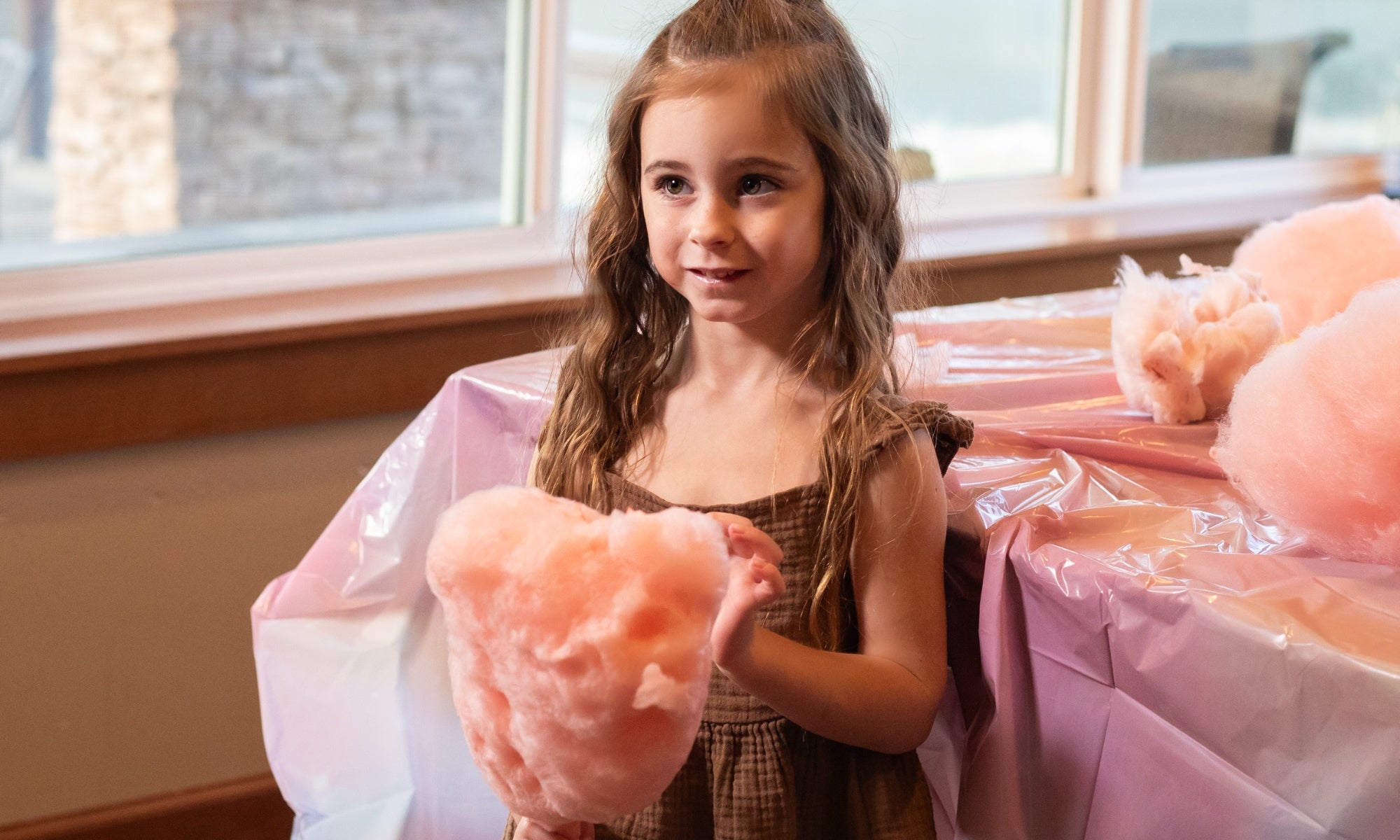 Girl holding Colorwayz dye-free cotton candy made with natural ingredients